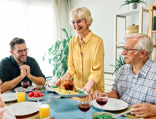 senior mature elderly couple active family lunch food woman meal eating mother dinner father...