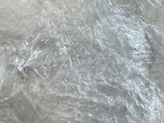Close up of plastic foil background, abstract gray paper background.