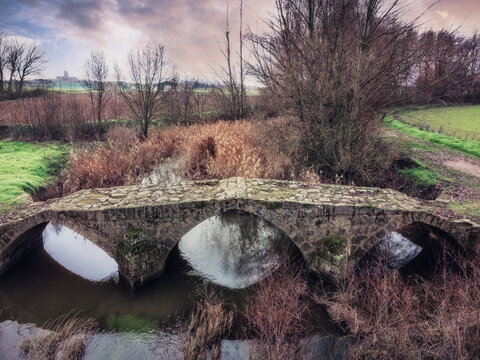 Roman bridge of San Miguel with cobblestones, Sasam&oacute;n, Burgos, Spain