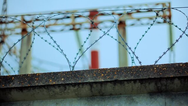 Prison razor wire fence . Barbed wire on restricted object