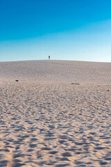 Silhouettes of people on sand dunes on Fuerteventura