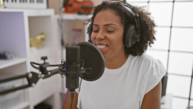 African american woman singing in a home music studio
