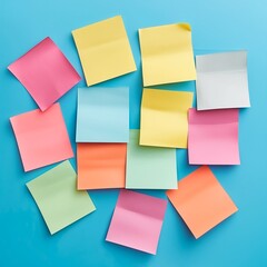colorful pink yellow green blue post-it with copy space on a blue background
