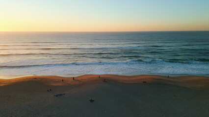 Fototapeta na wymiar Amazing evening sky ocean drone view. Foamy sea waves washing sandy beach.