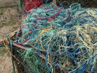 large pile of colorful fishing ropes and nets 