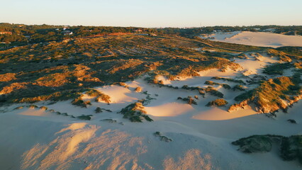 Obraz premium Aerial view desert landscape rough ground at sunset sunlight. Wild sandy slopes