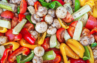 Salad of fresh vegetables, tomatoes, zucchini, eggplant and mushrooms.