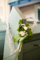 a wedding decoration on a church seat