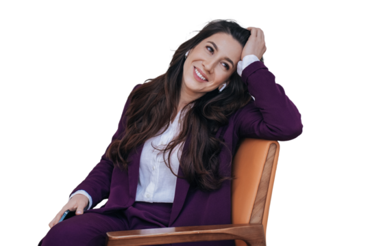 Cheerful businesswoman sitting on cozy chair, smiling looking aside against transparent background, toothy smiling, in violet suit, happy by completed deal. Satisfied woman relaxing
