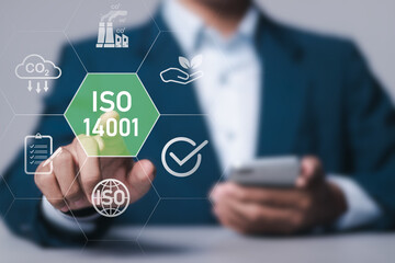ISO 14001 concept. Businessman with ISO 14001 certified for environmental management systems (EMS)....