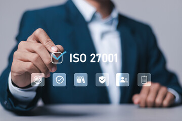 ISO 27001 concept. Businessman with ISO 27001 certified for information security management system...