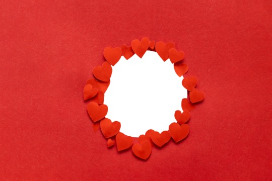 A circular frame surrounded by hearts against a red background, perfect for your Valentine's Day design