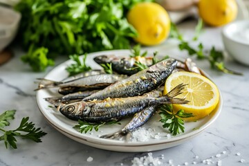 Sardines, lemon, greenery and salt on white plate on marble kitchen table. Mediterranean cuisine - obrazy, fototapety, plakaty