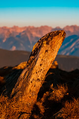 Alpine summer sunrise with details of a crystal-shaped rock at Mount Sechszeiger, Jerzens, Imst, Tyrol, Austria