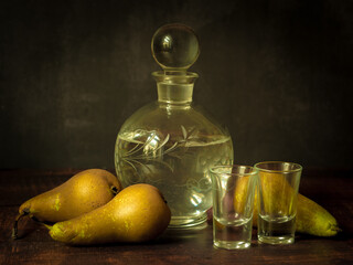 Antique-style still life with pears and alcohol. - 703832009
