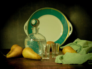 Antique-style still life with pears and alcohol. - 703832017