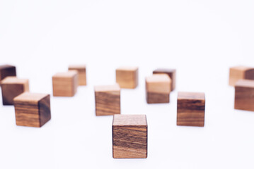 Scattered wooden cubes on a white background. Blocks
