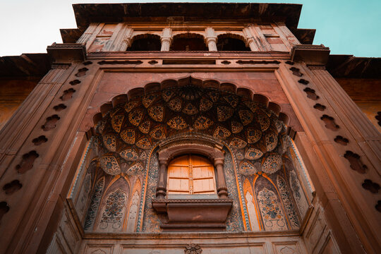 Entry Door of Safdarjung tomb with intricate carvings and paintings of peacock