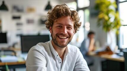Fototapeta premium In the office, a happy, smiling businessman
