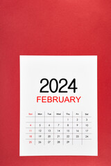 February 2024 calendar page with push pin on red.
