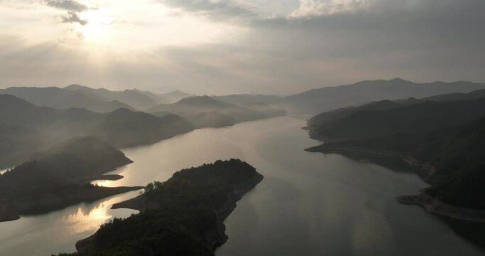 green mountains and river in mist