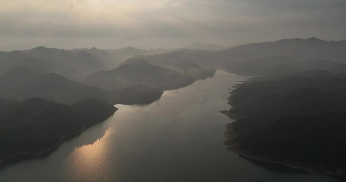green mountains and river in mist