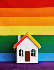 house with flag lgbt background. LGBT concept buying house.
