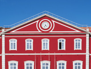 Santa Apolonia station in Lisbon with a shining red facade