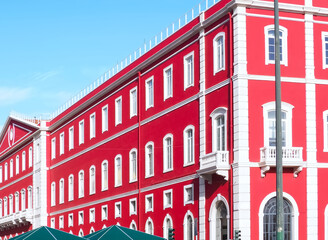 Santa Apolonia station in Lisbon with a shining red facade
