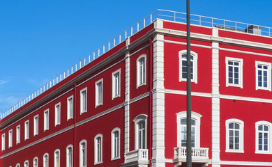 Santa Apolonia station in Lisbon with a shining red facade