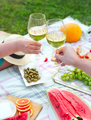 Young couple drinking wine outdoors