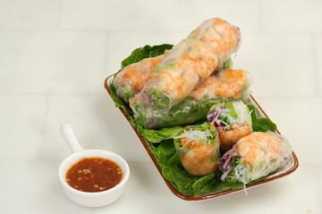 Fresh spring rolls with shrimp in rice paper. Rice paper rolls with shrimp, rice noodles,vegetable salad and sauce.