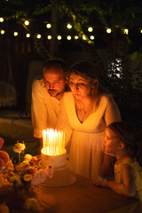 Wedding portrait of laughing newlyweds at night.