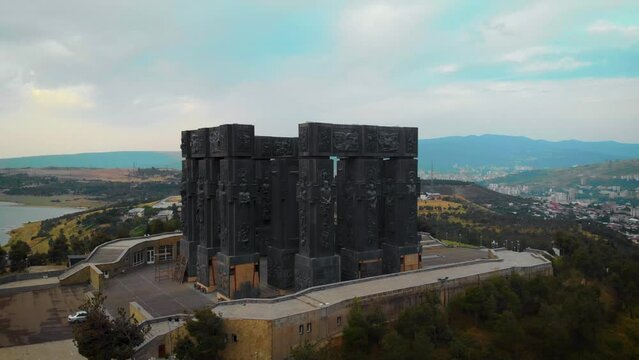 Aerial view of Monument History of Georgia, North of Tbilisi. Dramatic gray weather, overcast sky. Day time.