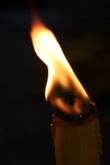 burning match in a fireplace