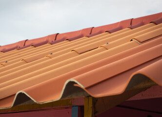 Prefabricated orange tile roof in simple house construction