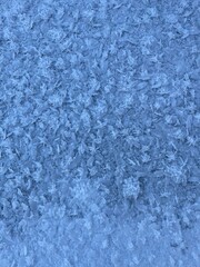 Winter blue natural background. Snow frosty patterns