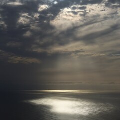 Clouds and sunstreak over the sea