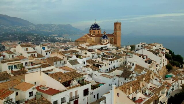 Spain Altea 4K Aerial Drone Video of Old Town White Houses and Famous Church with Blue Mosaic Domes Scenic Costa Blanca Coastal Landmark Mediterranean Architecture Travel