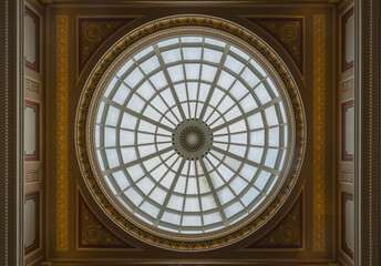 Light passes through The high ceiling glass dome inside main hall of The National Gallery. Ceiling...