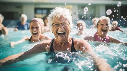 Poster Senior women enjoying  swimming class in a pool. displaying joy and camaraderie, embodying a healthy, retired lifestyle. © Banu