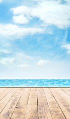 Wooden pier, exotic sea and a blue sky. Beautiful summer background. Vacation and traveling concept.