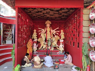 Idol of Goddess Devi Durga at a decorated puja pandal in Kolkata, West Bengal, India. Durga Puja is a popular and major religious festival of Hinduism that is celebrated throughout the world
