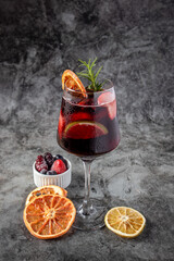 Christmas mimosa punch or cranberry margarita cocktail with cranberry juice, orange liqueur and champagne. Delicious icy drink for christmas holiday.