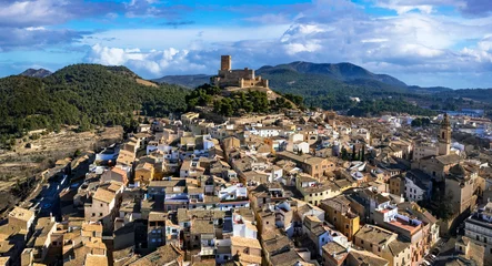 Rolgordijnen ancient Town Biar in Spain, Sierra de Mariola in the Vinalopo Valley in the province of Alicante . aerial drone panoramic view © Freesurf