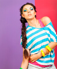 Portrait of a beautiful model with creative dynamic multicolor make up