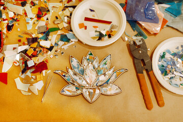 Master class of mosaic art. Closeup of mosaic in shape of lotus flower