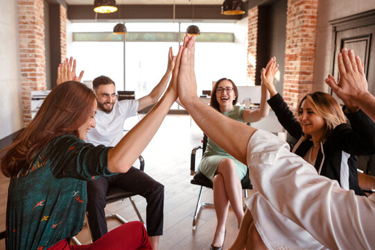 Office workers celebrating project finish