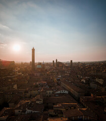 Bologna in the morning light from above, view from the sky, city landscape panoramic low sun view, Italian architecture from drone