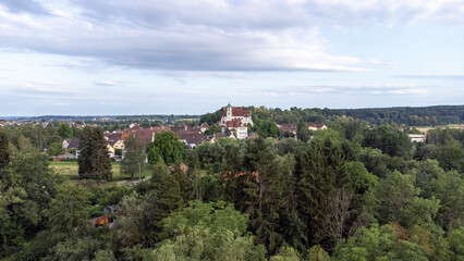 Obraz premium Scheer on the Danube river with St. Nicholas Church, taken from the air, drone image